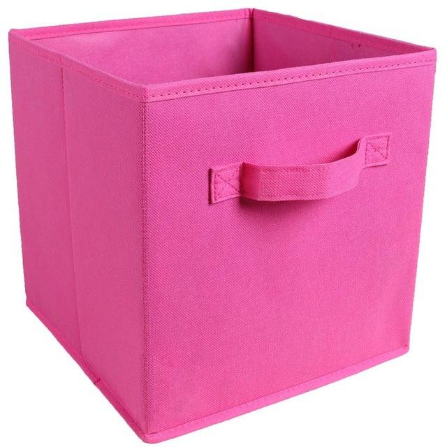 a pink pink box is sitting in a pink box 