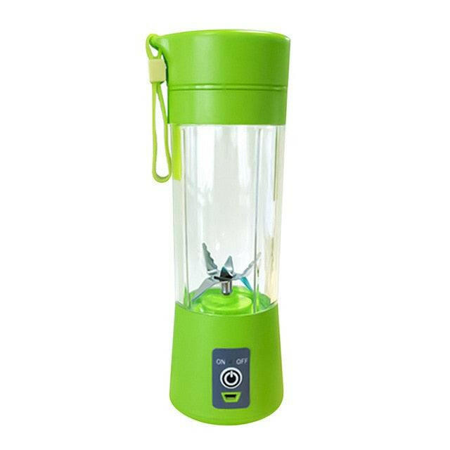 a green blender with a green plant in it 