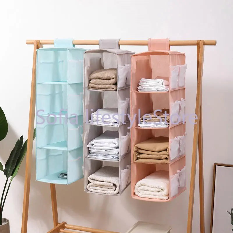 Multi-Layer Hanging Storage Bag Wardrobe Clothes Organizer . Garment organizer.