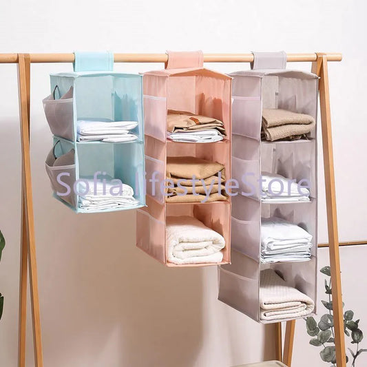 Multi-Layer Hanging Storage Bag Wardrobe Clothes Organizer . Garment organizer.